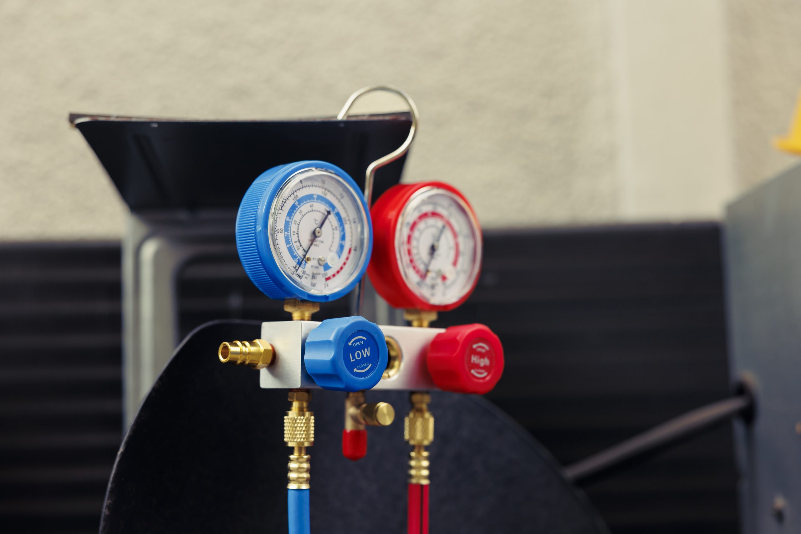 Close up of broken manometers used for checking hvac system freon pressure, in need of servicing. Set of barometer high or low refrigerant levels benchmarking air conditioner component